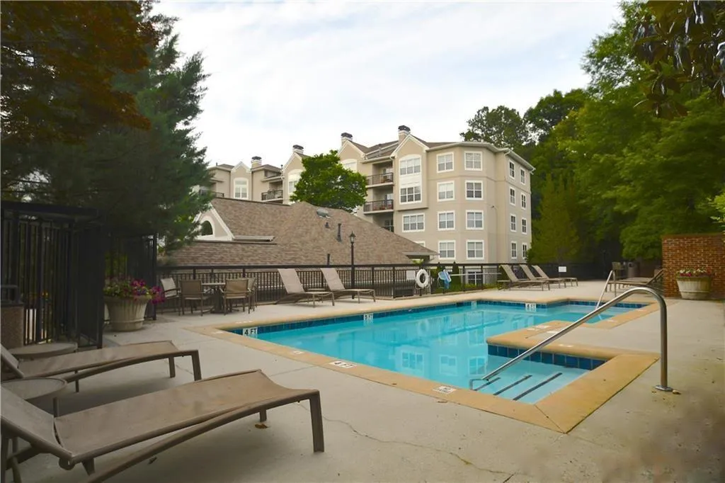 Community pool featuring a patio