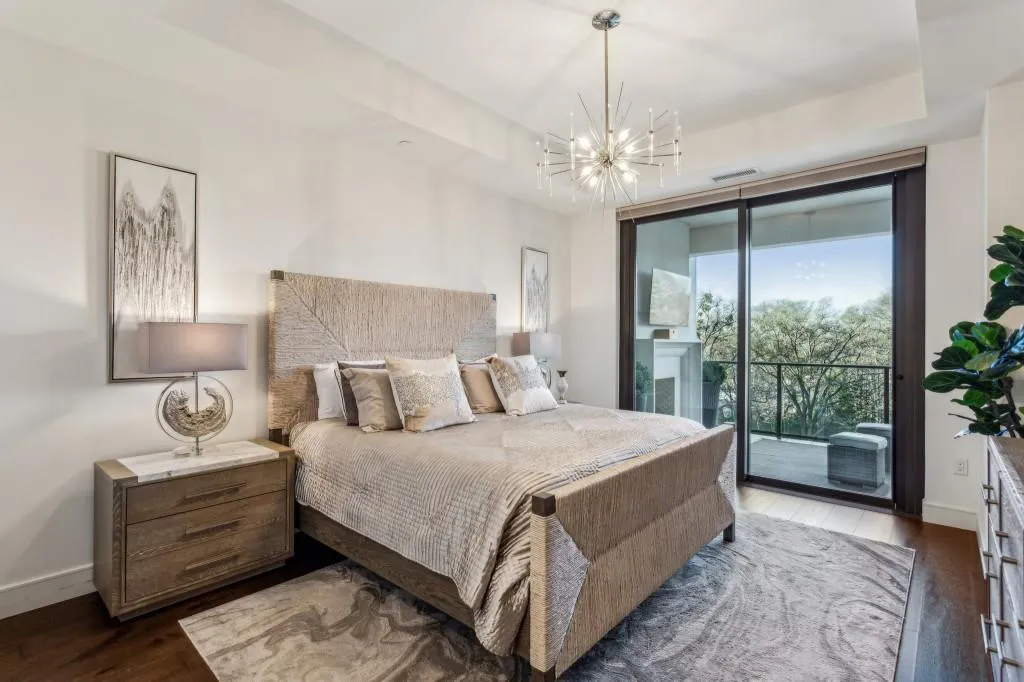 Primary Bedroom with access to fireside seating area on patio.