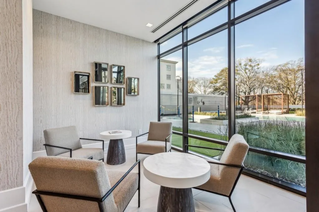 Seating area overlooking the pool and gardens.