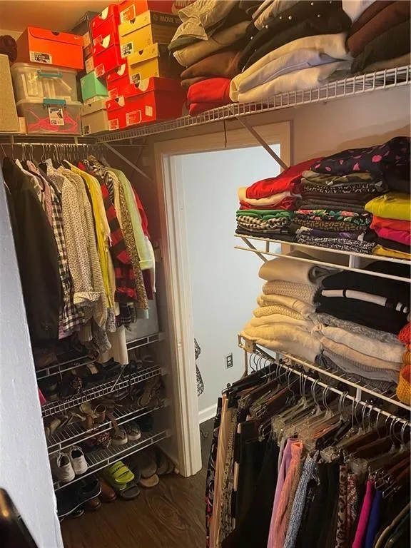 Spacious closet with wood finished floors