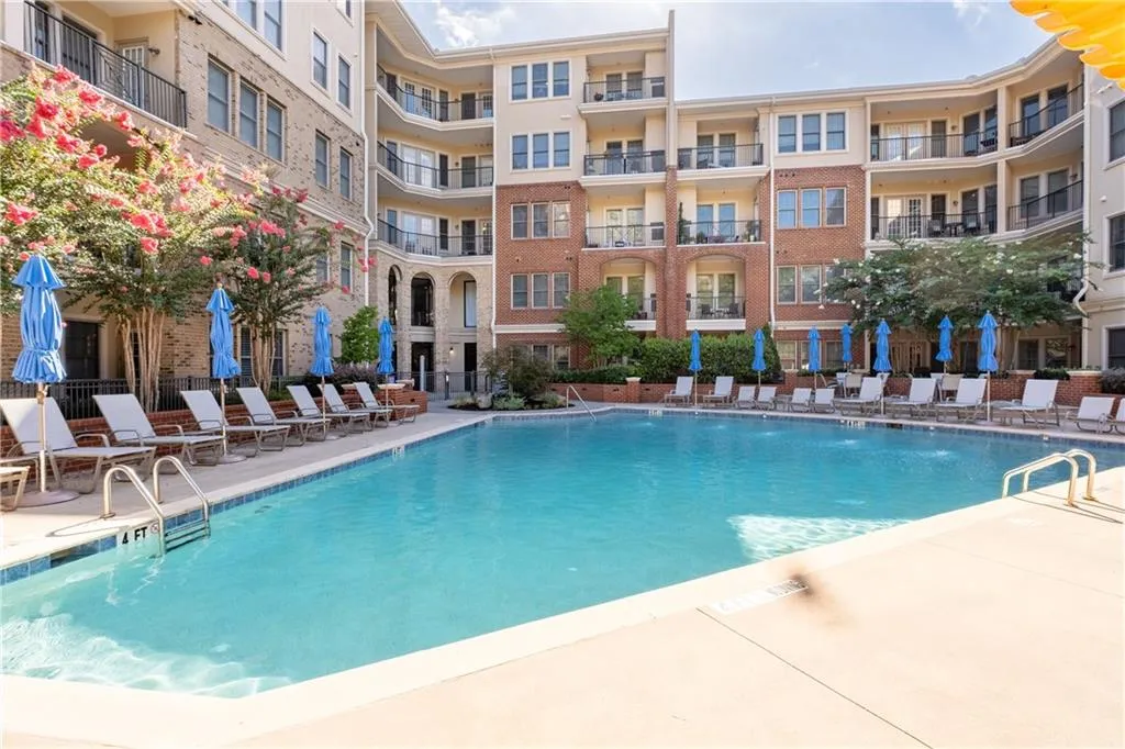 Community pool featuring a patio area