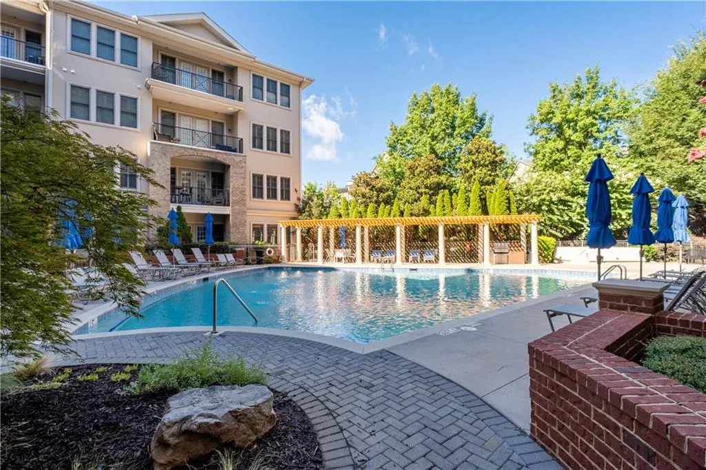 Community pool featuring a patio area