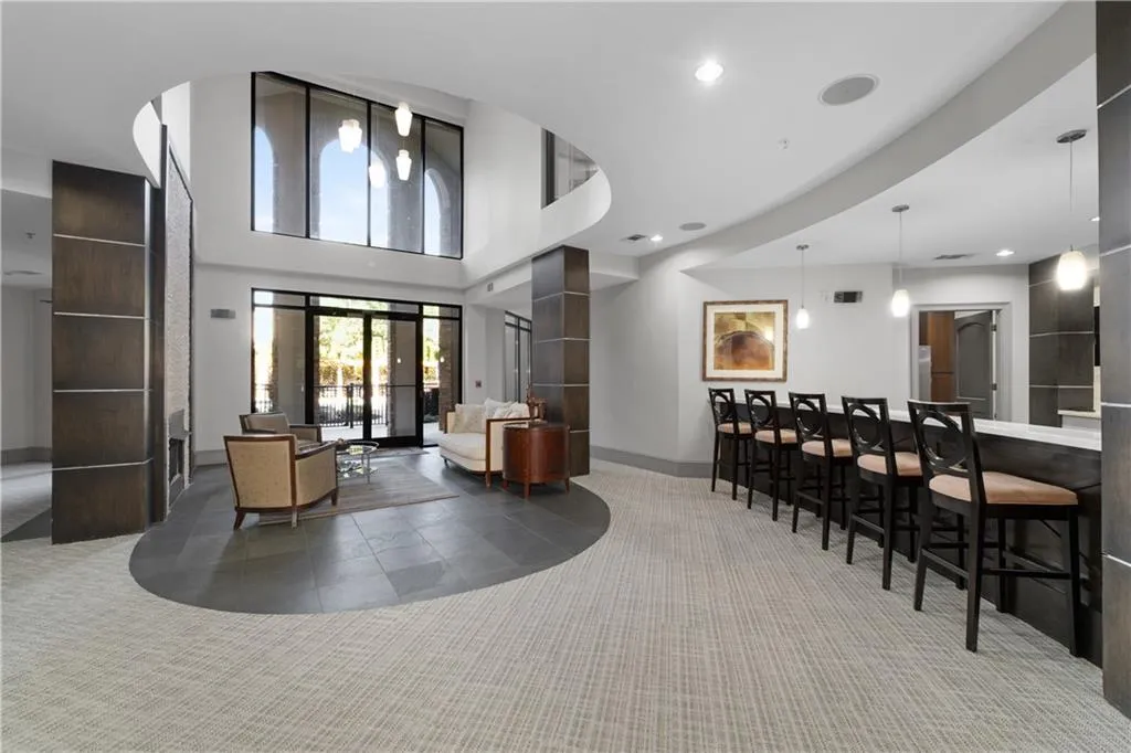 Common area featuring recessed lighting and a towering ceiling