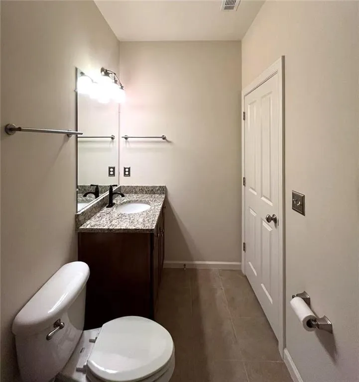 3rd level primary bedroom featuring ornamental molding, a tray ceiling, hardwood  floors, and ceiling fan