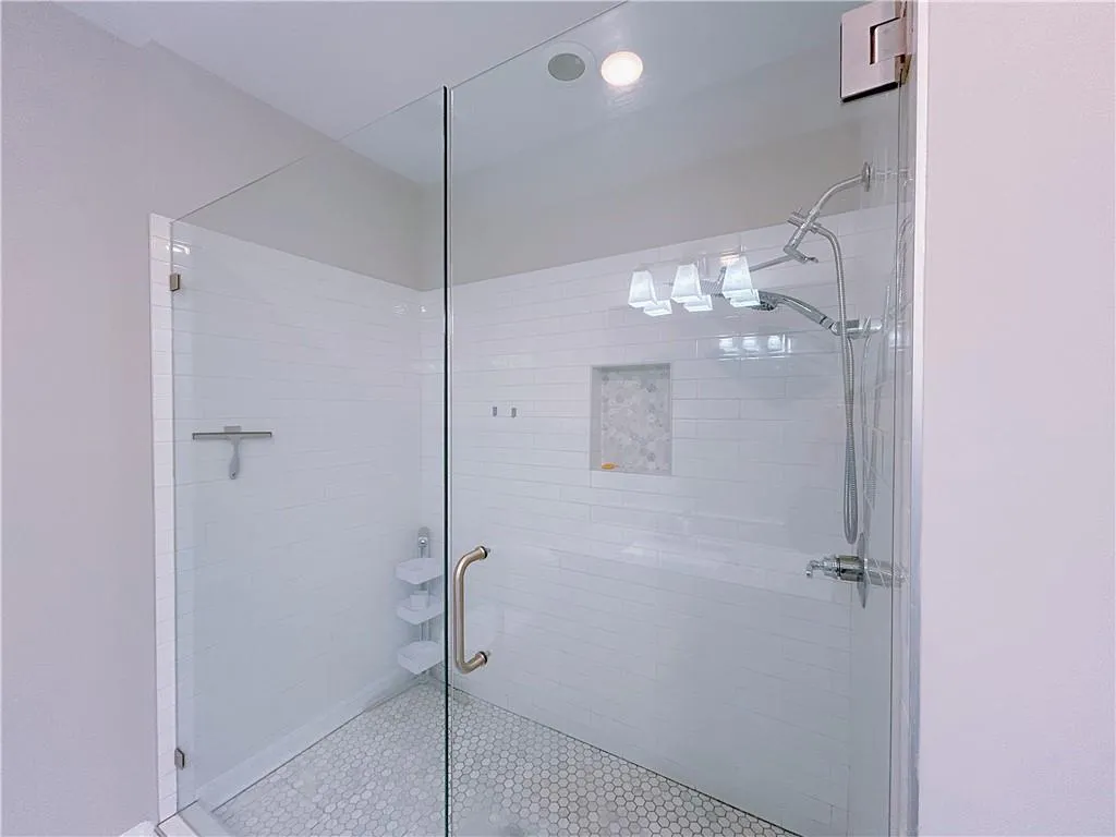 Bathroom featuring walk in shower