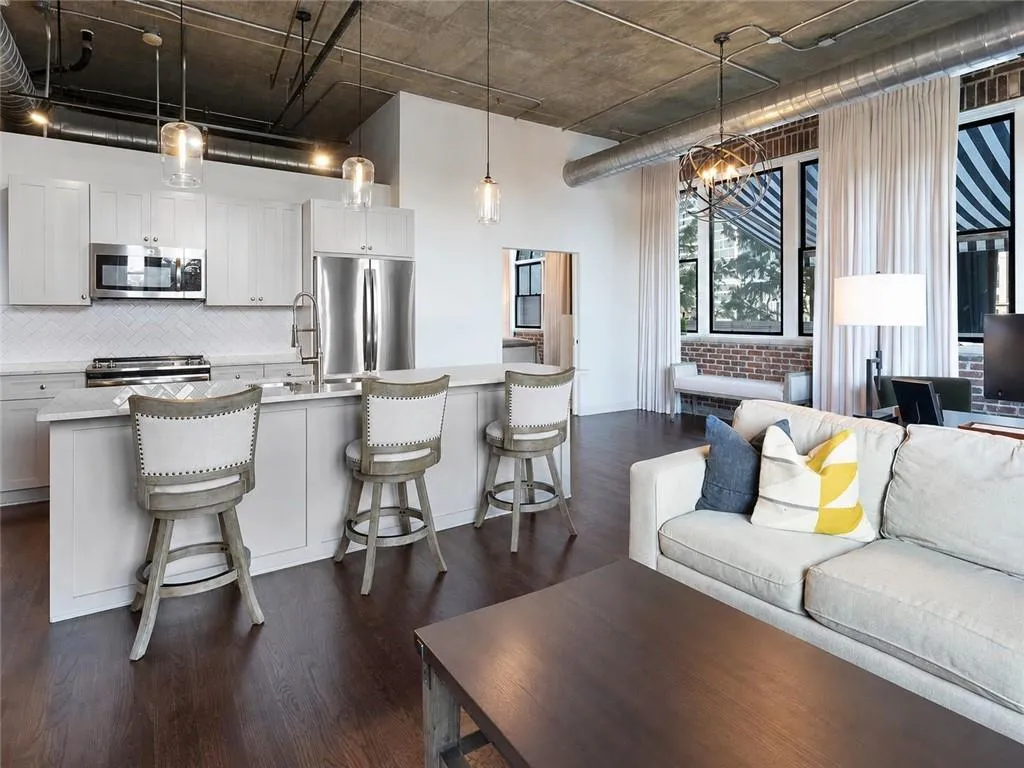 Exposed ceiling and ductwork with industrial pendant lighting