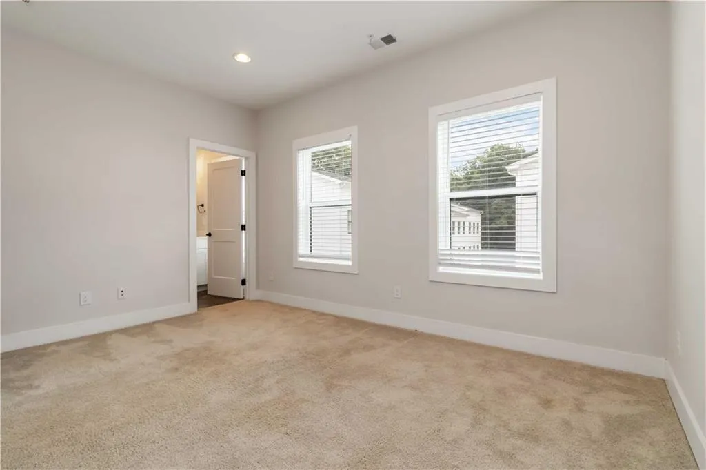 Unfurnished room with carpet and recessed lighting