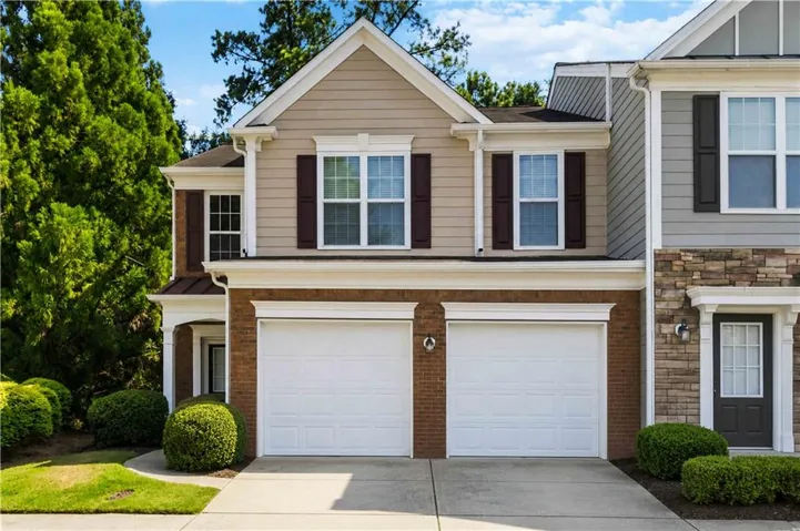 Brick and siding exterior with a two-car garage