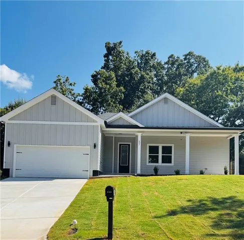 Light gray siding exterior with white trim accents