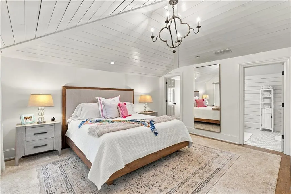 One of three upper level bedrooms. Large walk-in closet and ensuite bath.