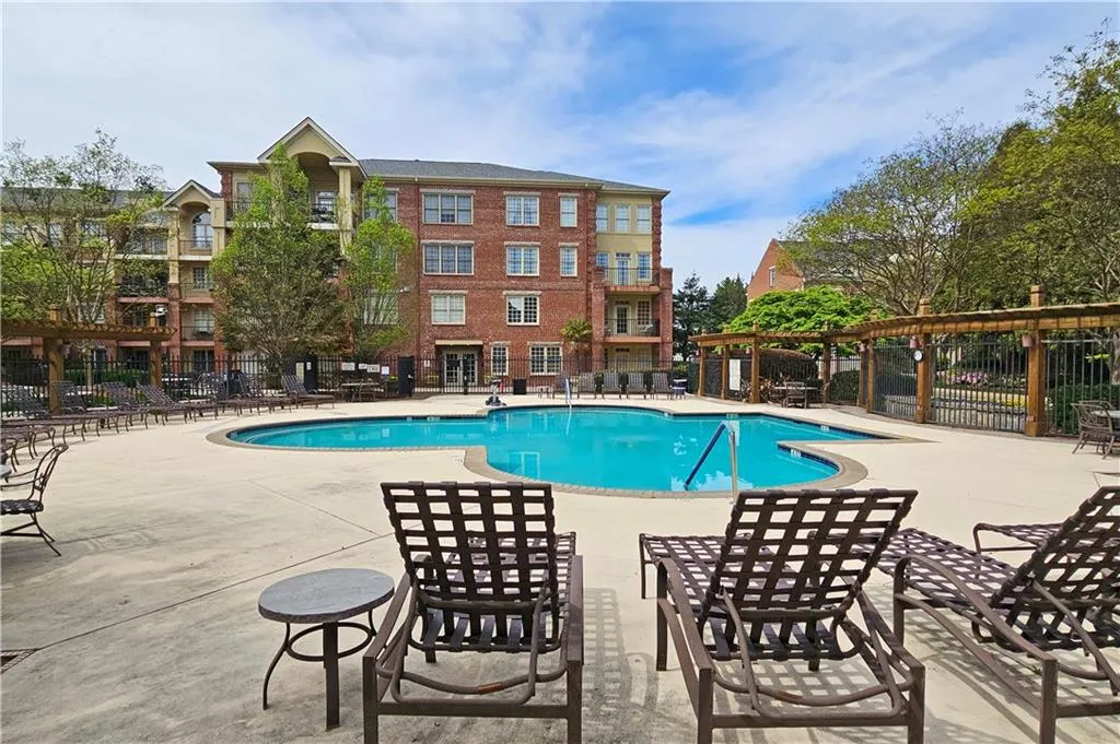 Community pool with a patio area