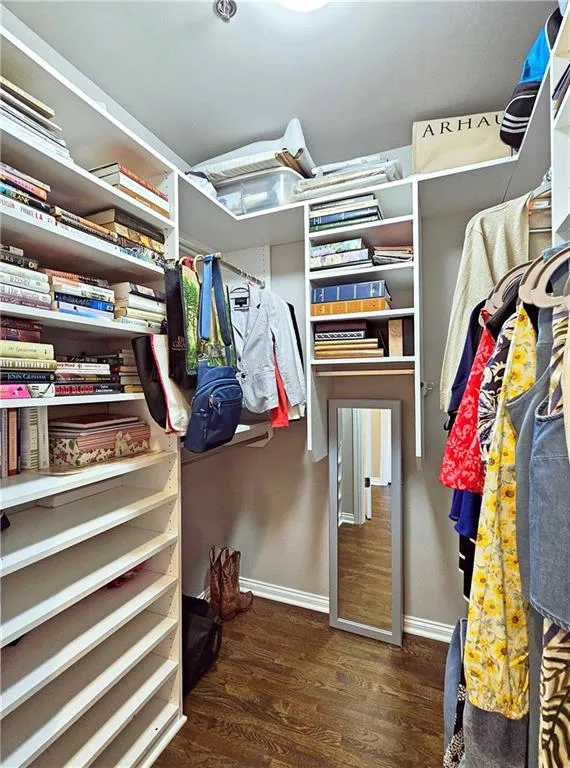 Spacious closet with wood finished floors