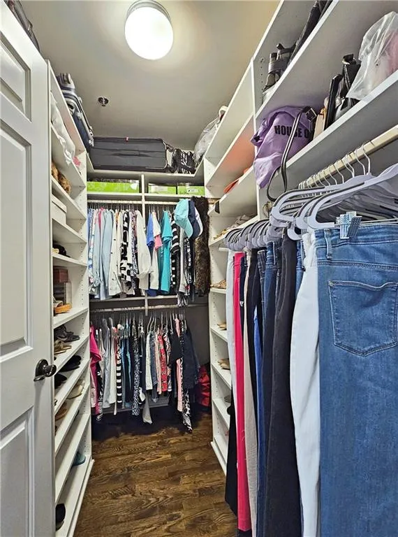Walk in closet featuring wood finished floors