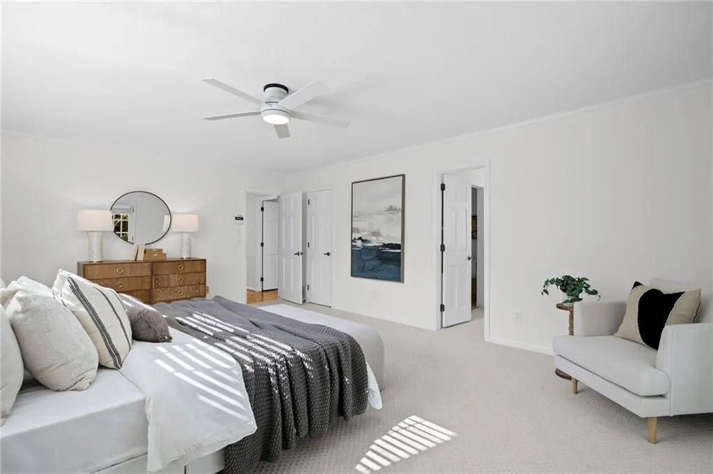 Main Level Ensuite Primary with bathroom and walk-in closet