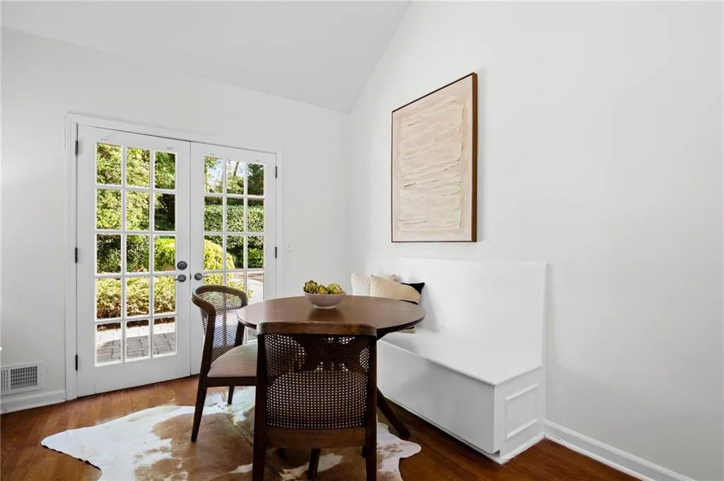 Breakfast dining space featuring built in bench and french doors leading to pool /grilling area