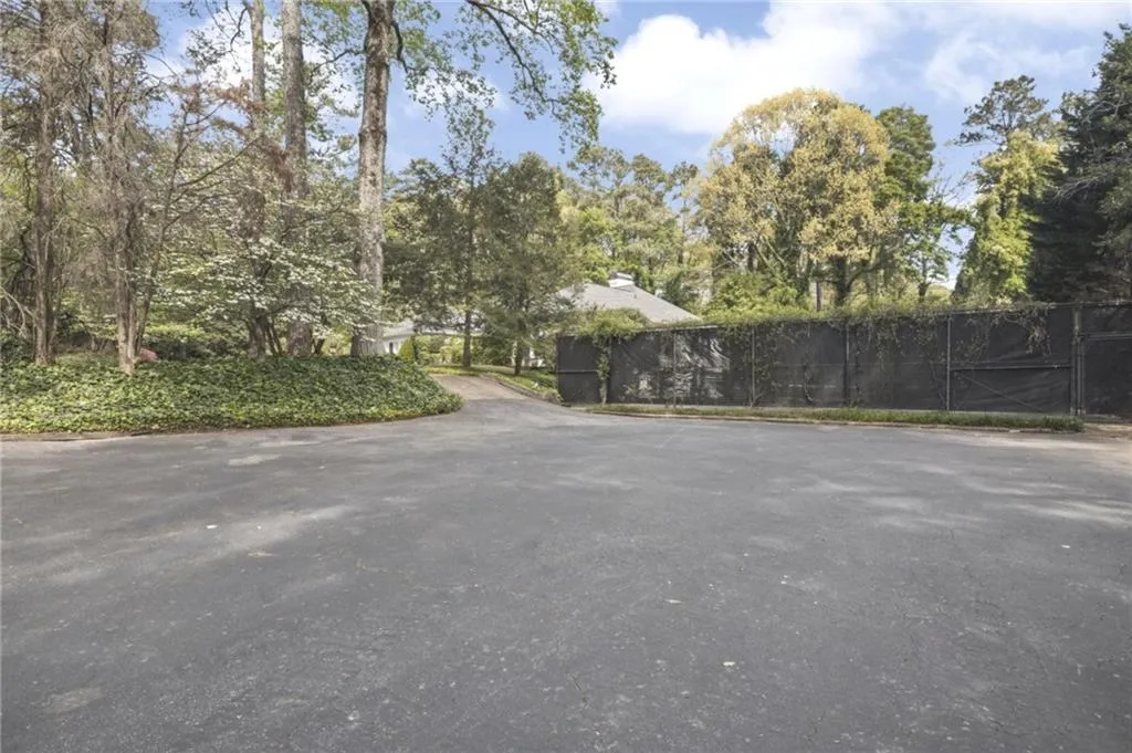 Parking pad in front of tennis courts