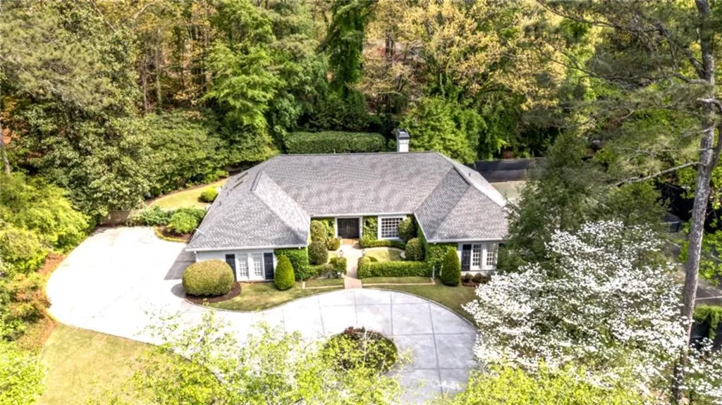 Aerial view of property and surrounding area.   Parking Pad and pull around drive allow for plenty of off-road parking