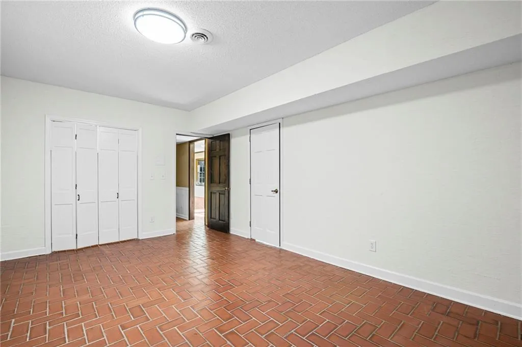 Bedroom 5 - Lower Level. Fresh paint and lighting