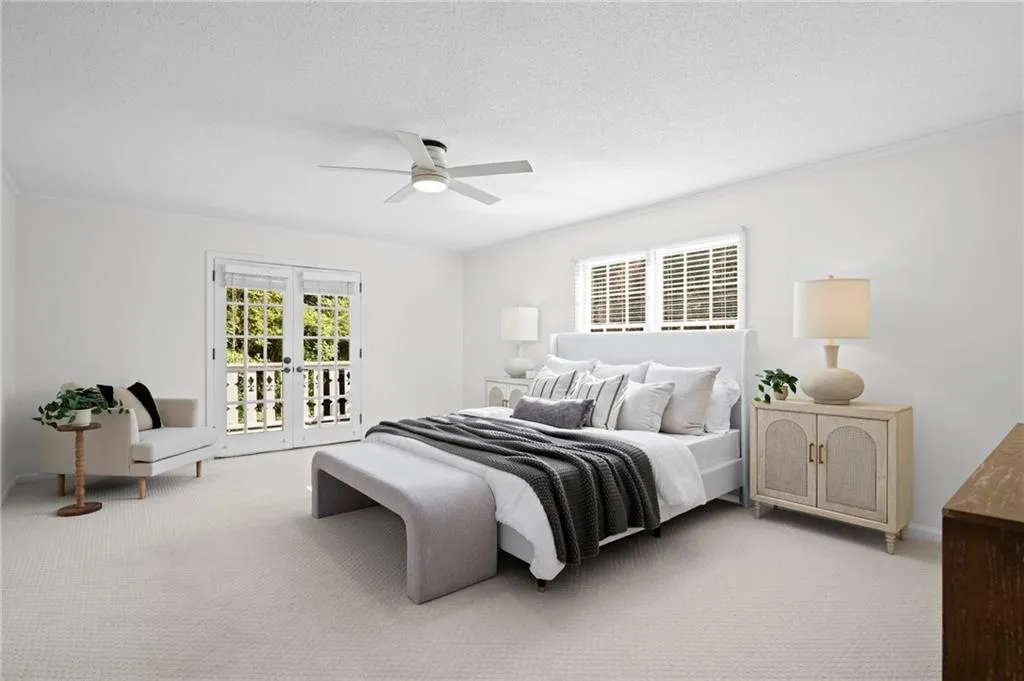 Primary Bedroom is large in size and has new paint, carpet, and lighting.  French doors leading to a private patio overlooking tennis court and pool!