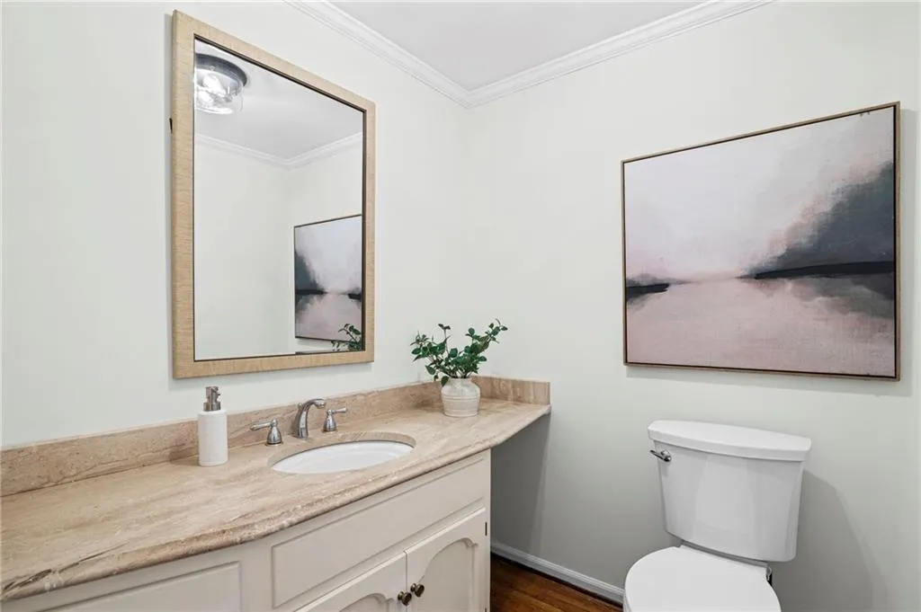 Powder bath conveniently located in hallway near dining and living room!