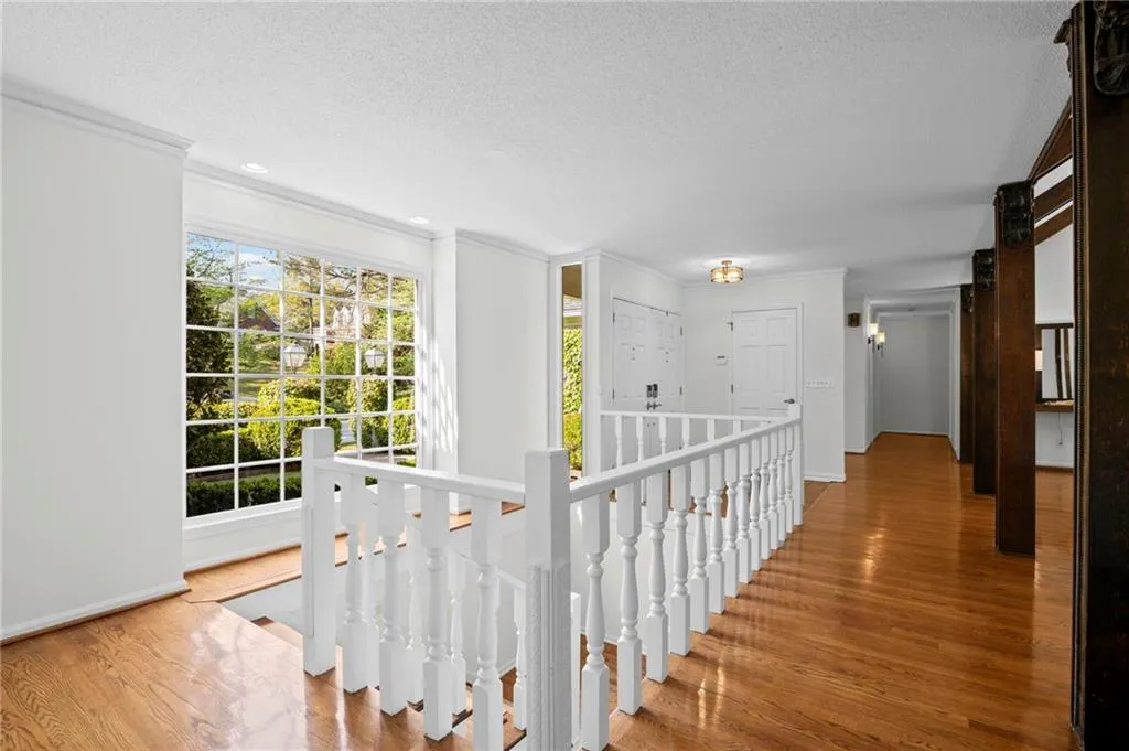 Upstairs landing with stairs leading to lower level