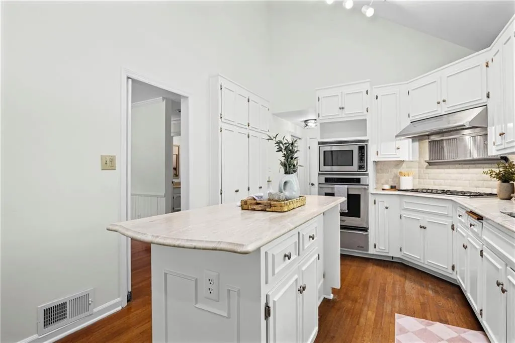 Ceiling is vaulted with skylights creating a kitchen filled with natural light