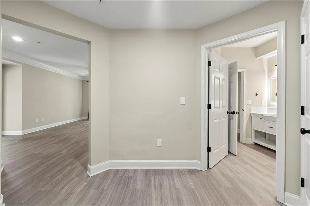 Hall featuring light wood-type flooring
