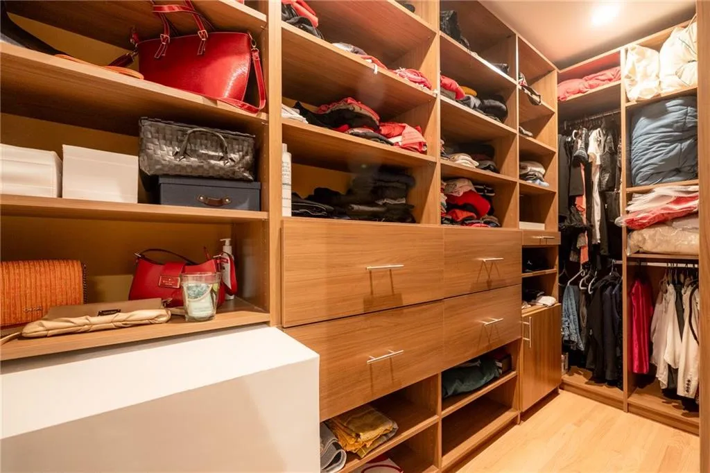 1 of 2 walk-in closets in the primary bedroom