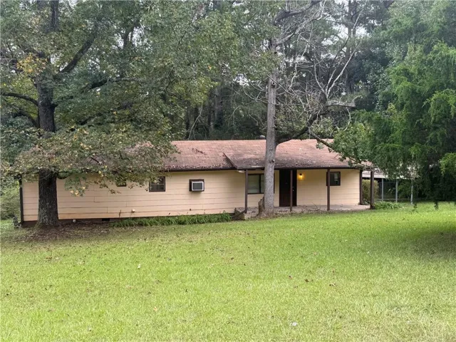 Single-story residence featuring a covered front porch and a gabled roof