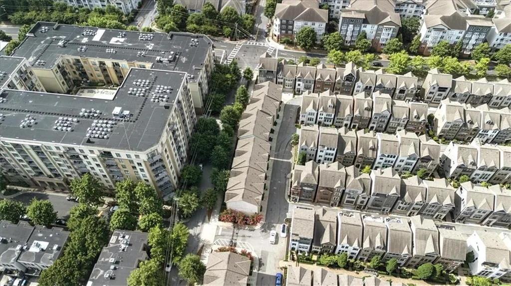 Aerial view of property's location with nearby suburban area
