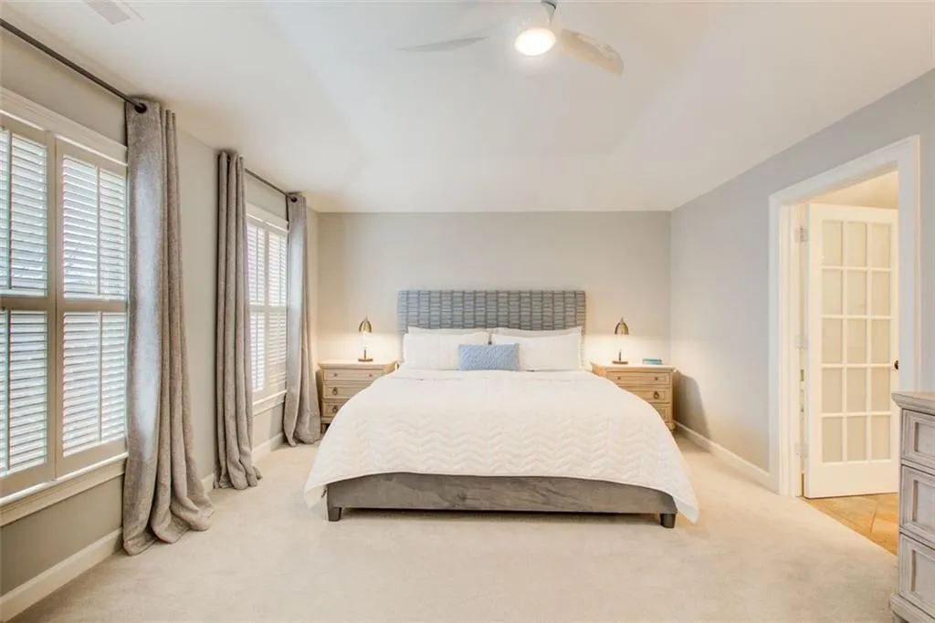 Wall of Windows floods the primary Bedroom with natural light