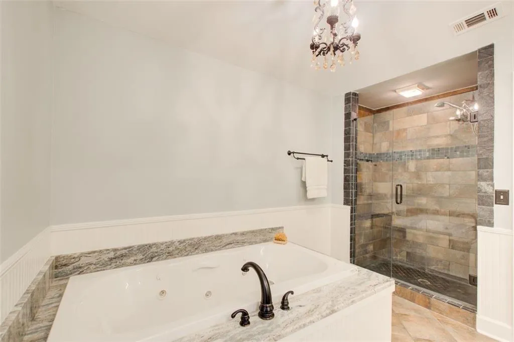 Separate shower and whirlpool tub in Primary Bath