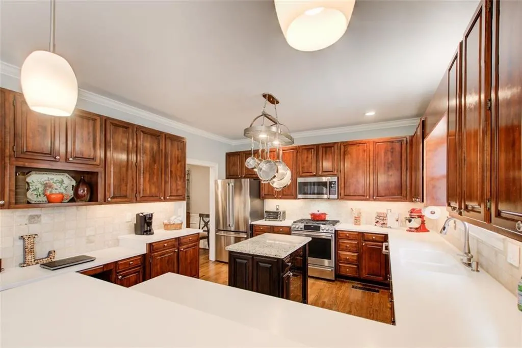 An Array of impressive Cherry Oak Cabinets surrounds the kitchen. Plenty of storage space!