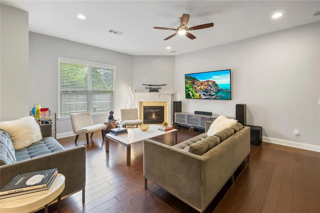 Living room with ceiling fan and Hardwood  flooring