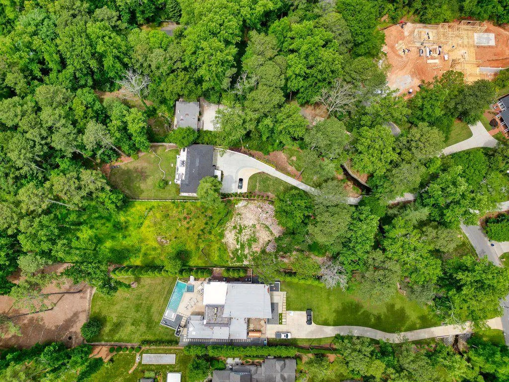See the expansive multi million dollar estates the neighbors' have built on same-sized lots with pools, gardens, garages, and guest houses.