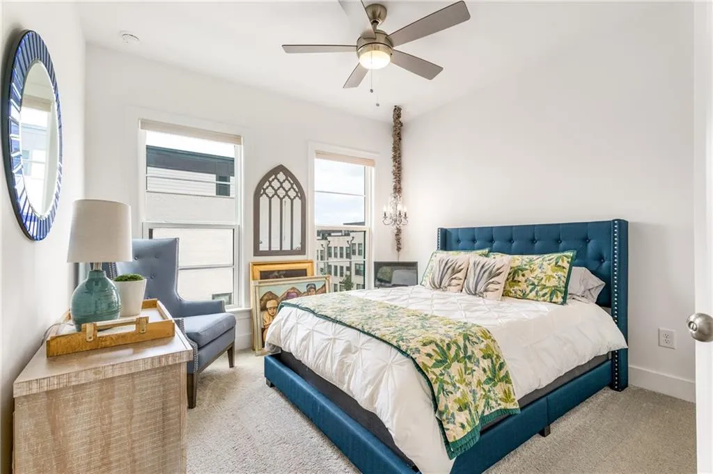 Bedroom with carpet floors and a ceiling fan