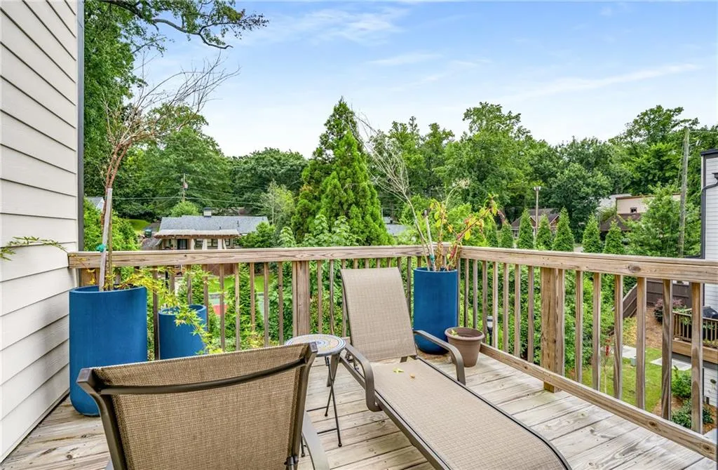 Wooden terrace with view of wooded area