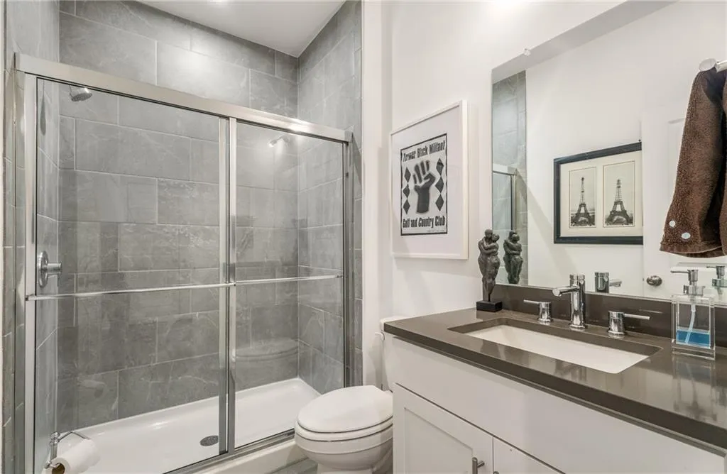 Bathroom with vanity and a shower stall