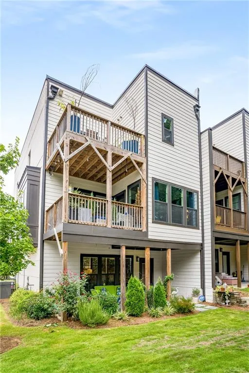 Rear view of property featuring a yard