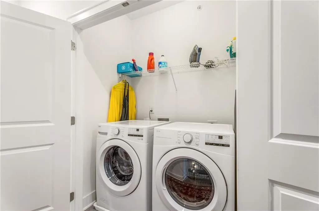 Laundry area with washer and clothes dryer