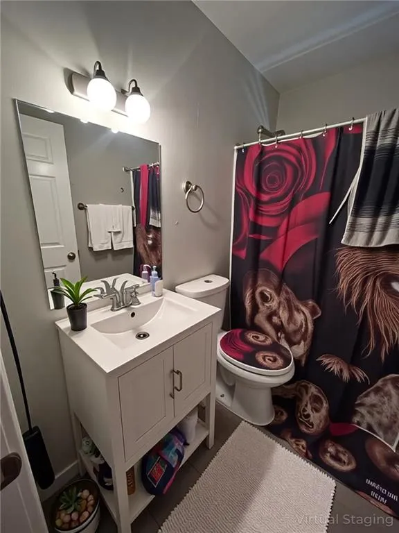 Bathroom featuring vanity and a shower with curtain