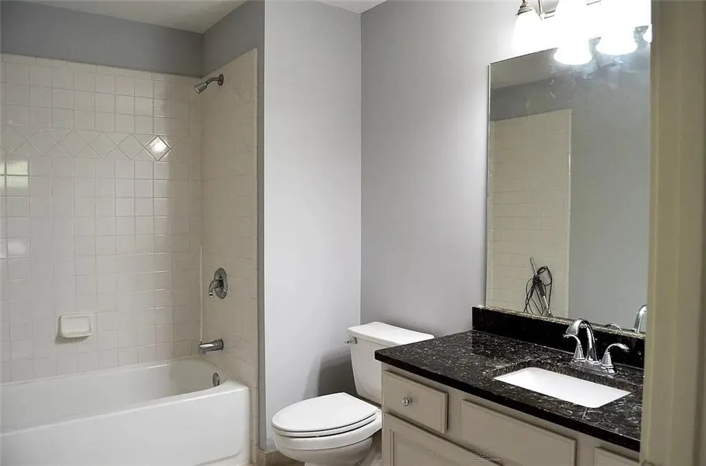 Bathroom featuring bathing tub / shower combination and vanity