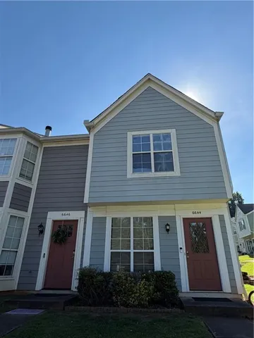 Two-story exterior with light blue and gray siding