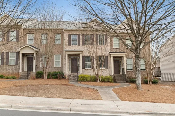 View of front of house featuring brick siding and entry steps