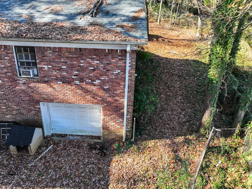 View of side of property featuring a garage
