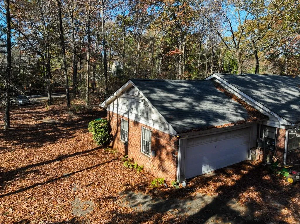 View of side of property with a garage