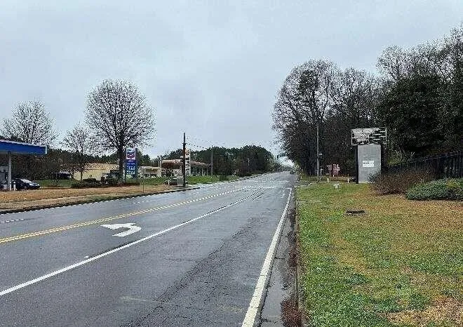 View of asphalt street with curbs