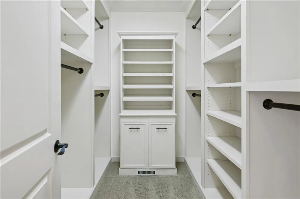 Custom walk in primary closet.