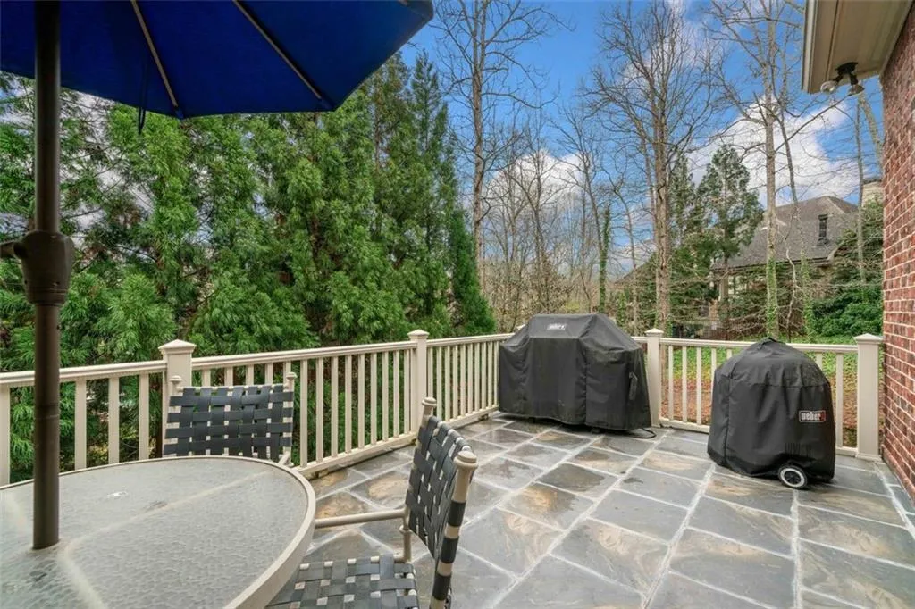 Side Grill Patio off Kitchen with Built-in Gas Line and Views of Backyard