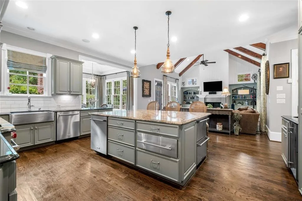 Kitchen Seamlessly Flows into the Beamed Great Room